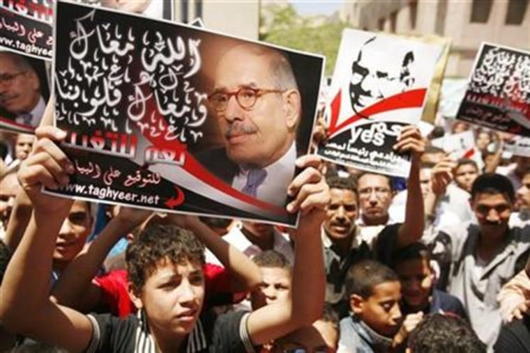Supporters of former head of the UN nuclear agency ElBaradei chant slogans during a rally in Fayoum