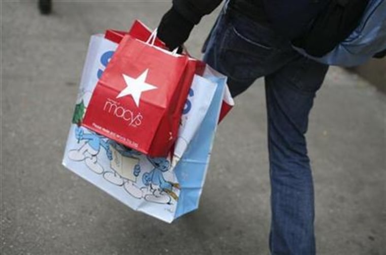 Shopper carries bags along sidewalk in New york