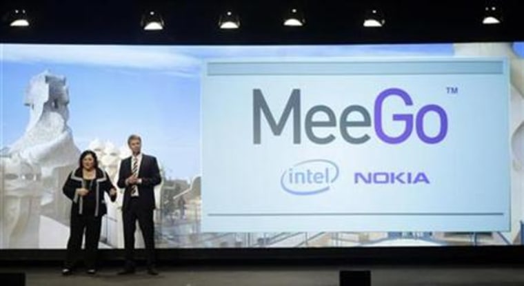 Nokia's Oistamo and Intel's James speak during 'MeeGo' presentation at the Mobile World Congress in Barcelona