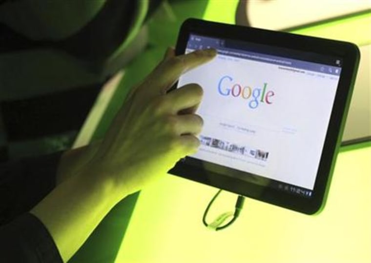 The Google home page is shown on Google's latest version of the Android operating system, Honeycomb, on a Motorola Xoom tablet device in Mountain View