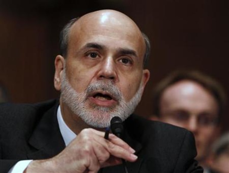 Chairman of the Federal Reserve Ben Bernanke talks to Senators at the Senate Banking Committee in Washington