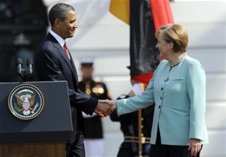 U.S. President Obama shakes hands with German Chancellor Merkel during an official State Arrival ceremony at the White House