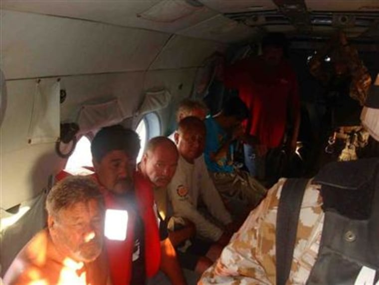 Handout photo of rescued tourists abroad a naval helicopter in an undisclosed area near Mexico's Baja California peninsula