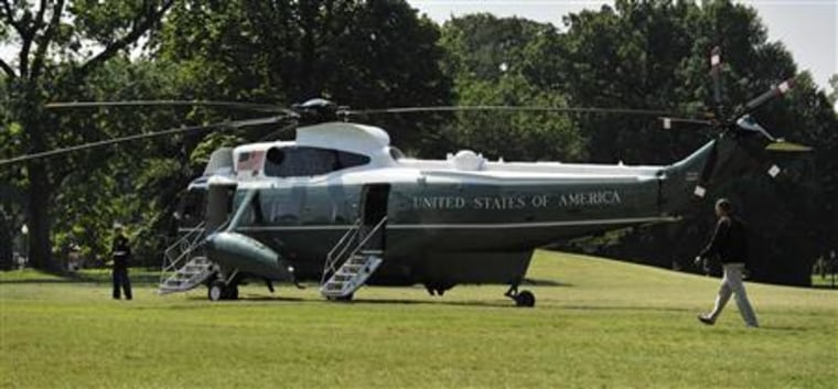 Obama walks across the South Lawn to depart via Marine One  helicopter for a visit to Camp David, from the White House in Washington