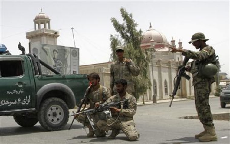 Afghan police set up a roadblock in front of the Red mosque in Kandahar city, after a suicide blast inside the mosque
