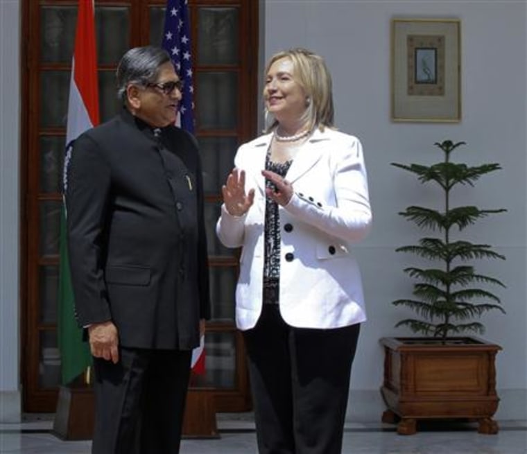 Secretary of State Clinton speaks with India's Foreign Minister Krishna during a photo call before their meeting in New Delhi