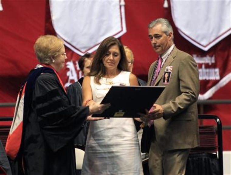 Provost Judy Bonner awards a posthumous diploma for Ashley Harrison during University of Alabama commencement ceremony at Coleman Coliseum in Tuscaloosa Alabama