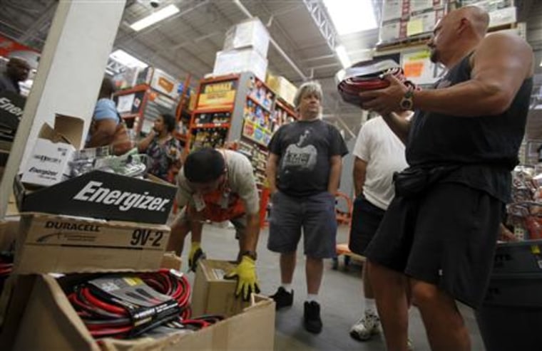 People shop for supplies to weather approaching Hurricane Irene at a Home Depot store in Freeport on Long Island
