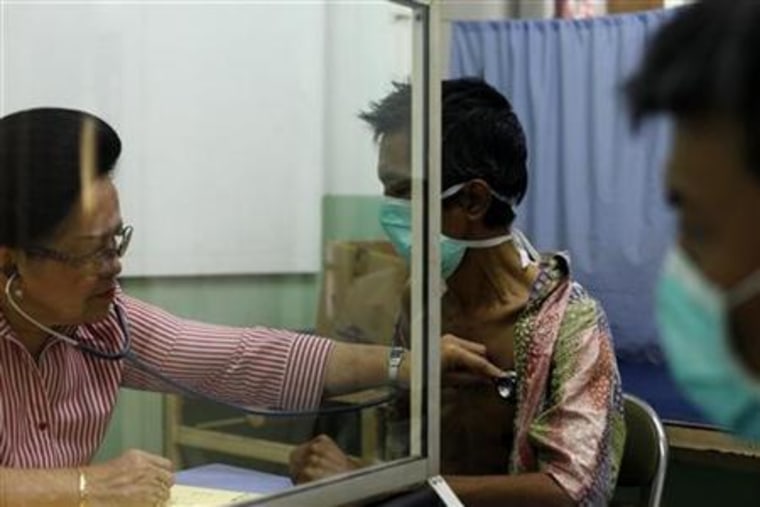 Doctor Marion Aritonang checks the lungs of a newly diagnosed tuberculosis patient at the Indonesian Union Against Tuberculosis clinic in Jakarta