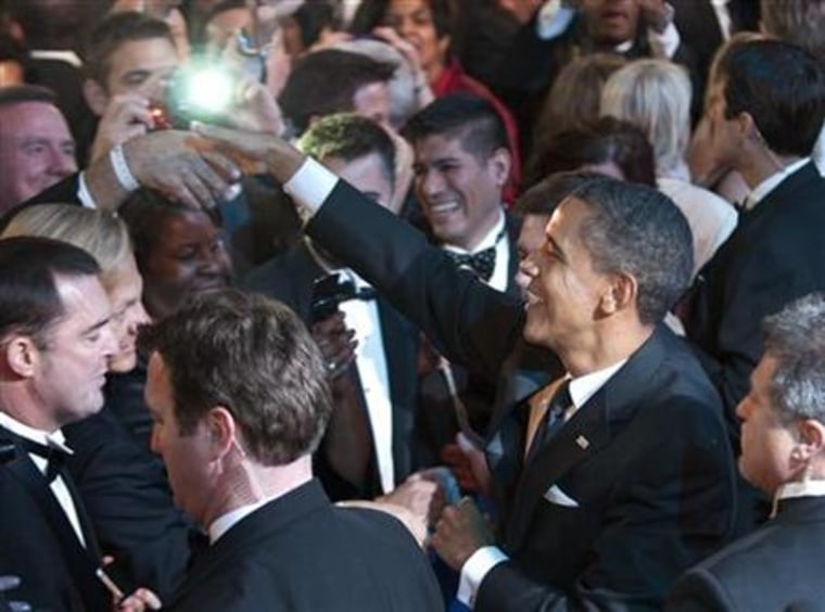 Obama greets attendees after delivering remarks at the Human Rights Campaign's annual dinner in Washington