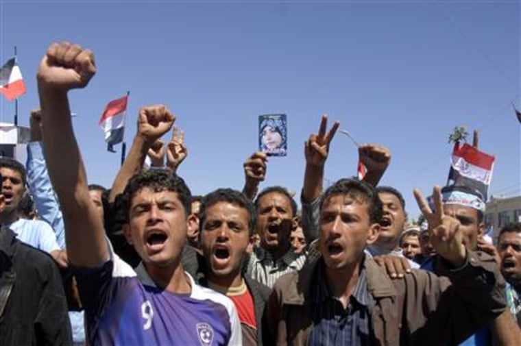Anti-government demonstrators march during a protest to demand the ouster of Yemen's President Ali Abdullah Saleh in Sanaa
