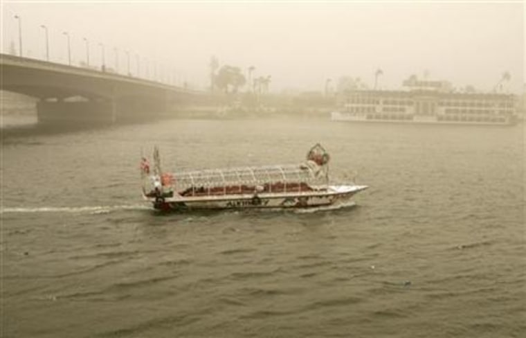 A boat cruises on the Nile River during a massive sandstorm in Cairo