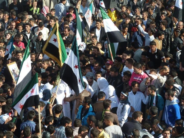 Demonstrators protest against Syria's President Bashar al-Assad gather in Hula, near Homs