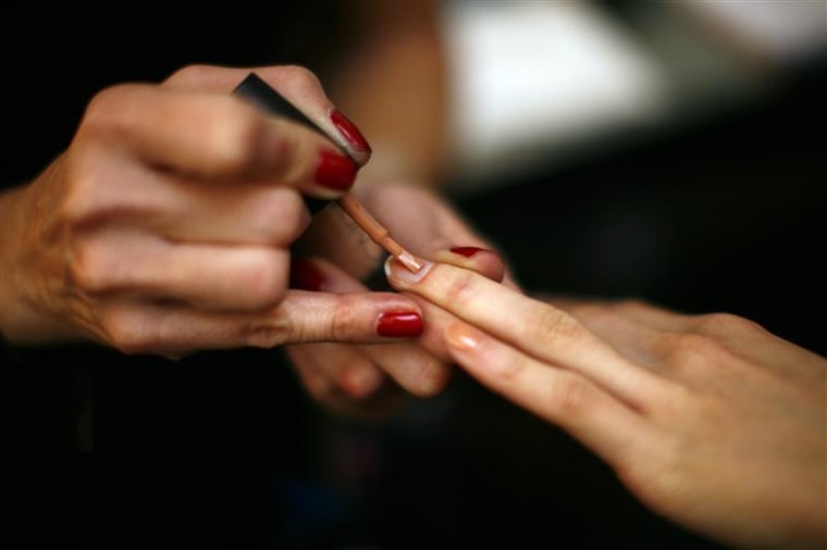 A model has her nails painted backstage before the Jenni Kayne Fall/Winter 2011 collection show during New York Fashion Week