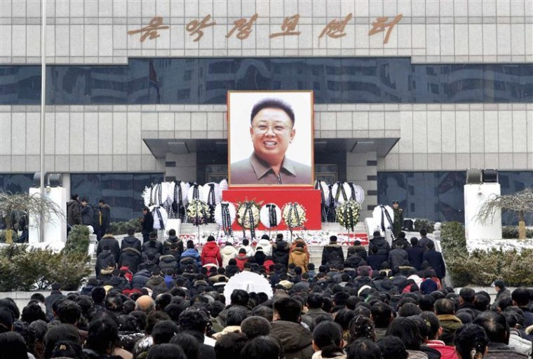 North Koreans make a call of condolence for deceased leader Kim Jong-il in Pyongyang