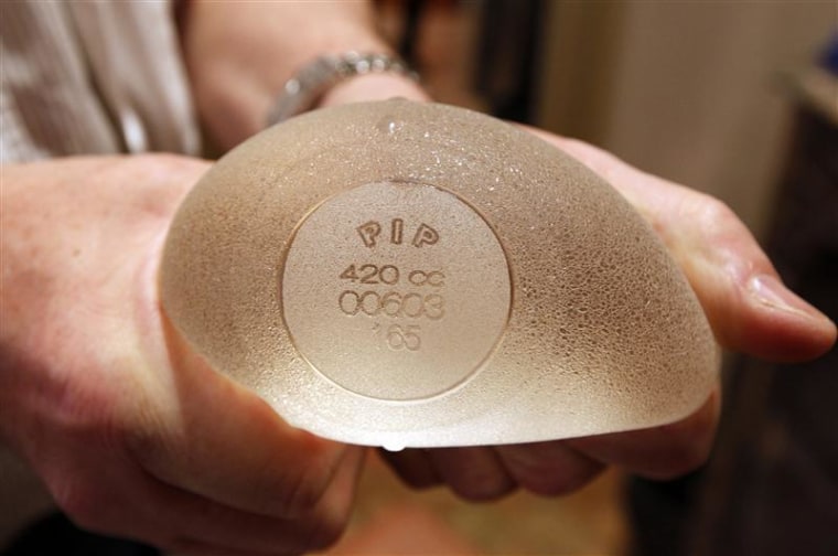 Plastic surgeon Boucq displays a silicone gel breast implant manufactured by French company Poly Implant Prothese (PIP) in a clinic in Nice