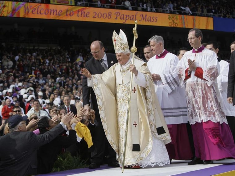 Pope Benedict XVI greets Catholic faithful as he exits the altar after celebrating Mass at Yankee Stadium in New York