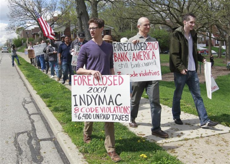 Members of Occupy Cincinnati march through the Price Hill neighborhood during a rally in Cincinnati