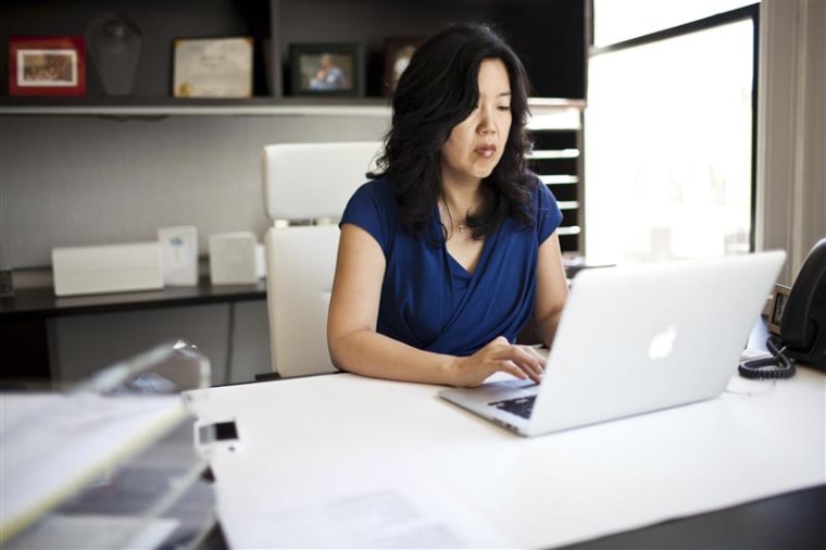 Michelle Rhee, founder and CEO of StudentsFirst, works on a computer at her office in Sacramento, California