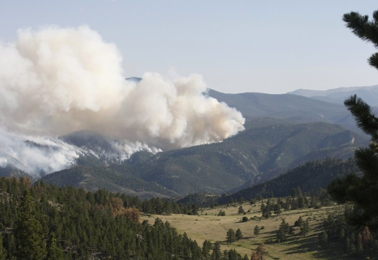 Smoke rises from the raging High Park fire west of Fort Collins