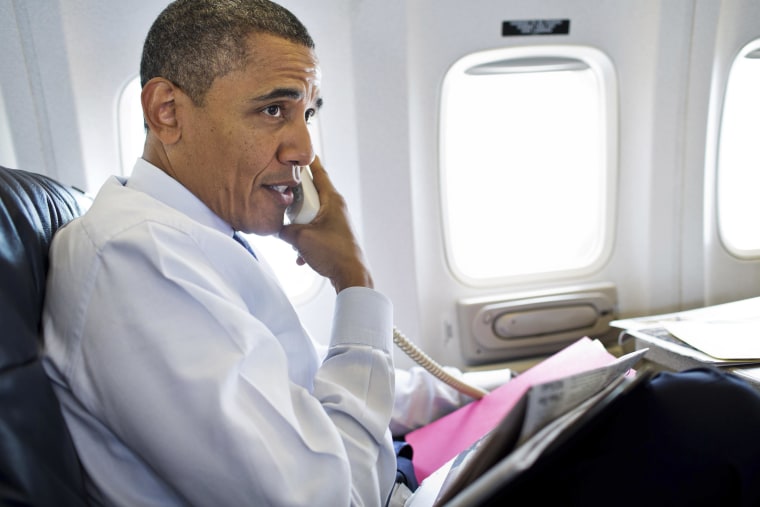 President Barack Obama talks on the phone with members of the U.S. Olympic women's gymnastics team during a phone call from Air Force One