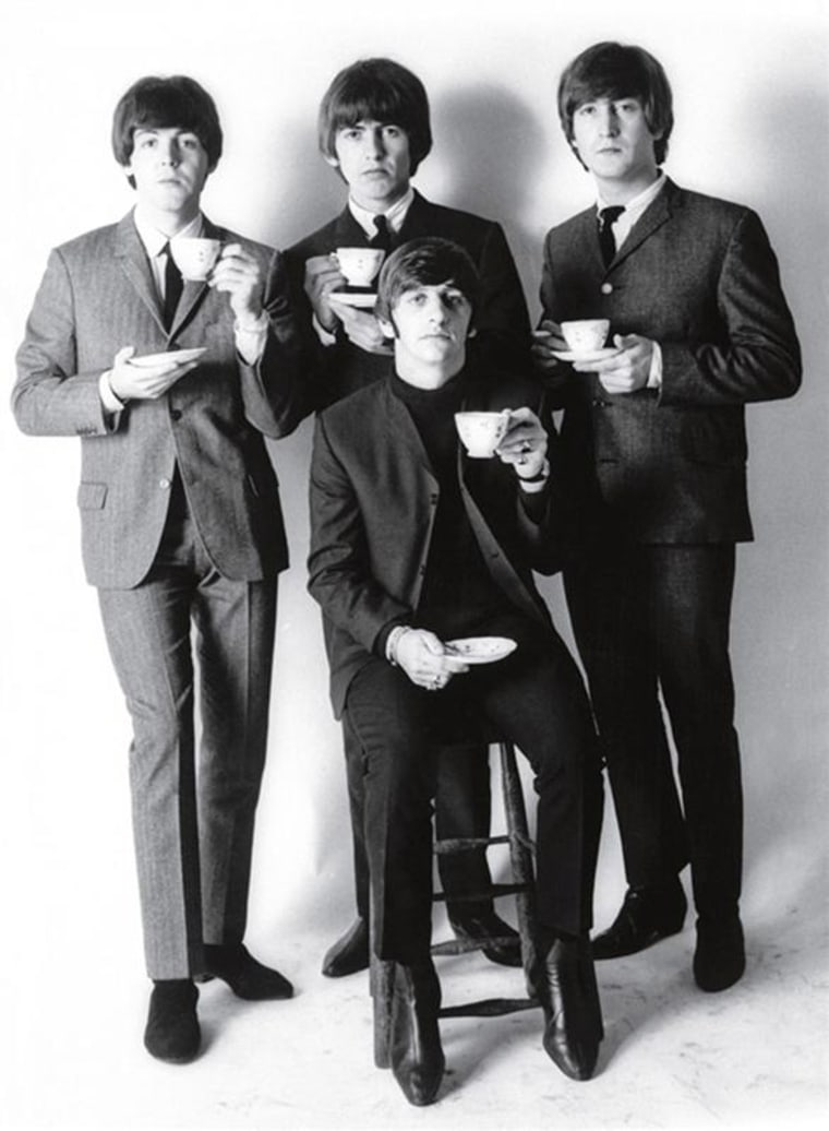 An undated handout photo shows The Beatles in a formal studio setting