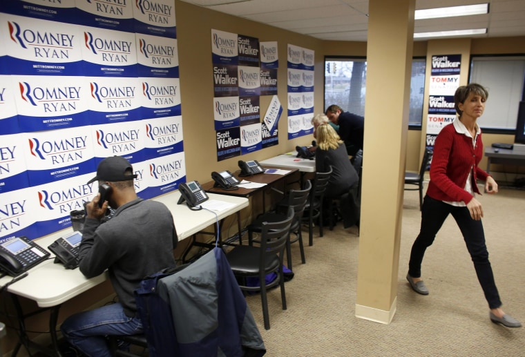 Volunteers work the phones at a Romney/Ryan office as each party gets in their last efforts the day before election day in Wauwatosa