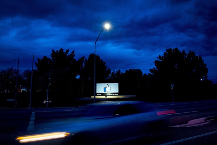 Image:  A car passes by Facebook's corporate headquarters location in Menlo Park, Calif., on March 21, 2018.