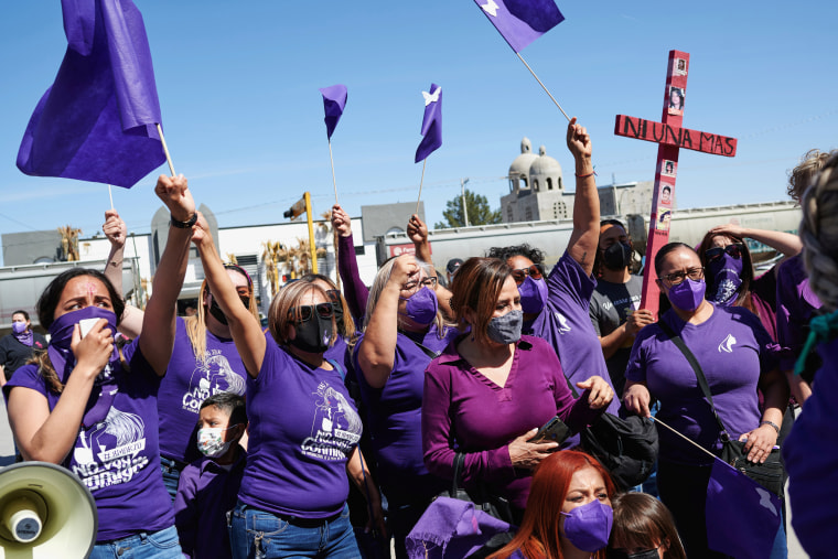 Mothers and relatives walk holding crosses during an event demanding an end to violence against women and femicide, ahead of a Women's Day protest, in Ciudad Juarez, Mexico, on March 7 , 2021
