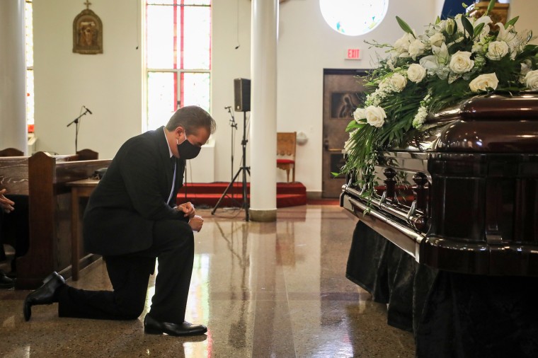 Charles Villasenor prays before the funeral service of his mother, Lois Villasenor at Our Lady of Guadalupe Parish on Aug. 6, 2020, in Austin, Texas.