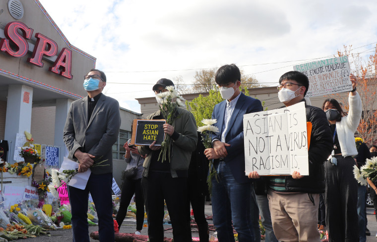 Image:; Asian American church leaders held a vigil Sunday in front of the Gold Spa in Atlanta.