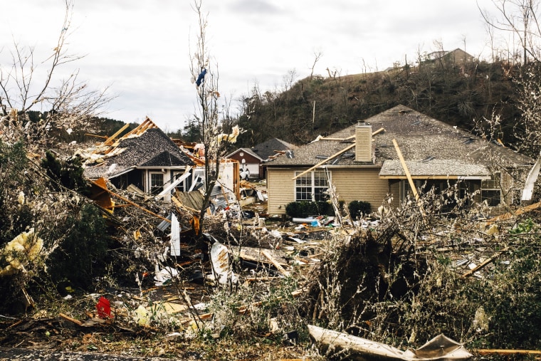 Fallen trees damage a property in the wake of a tornado on Jan. 26, 2021, in Fultondale, Ala.