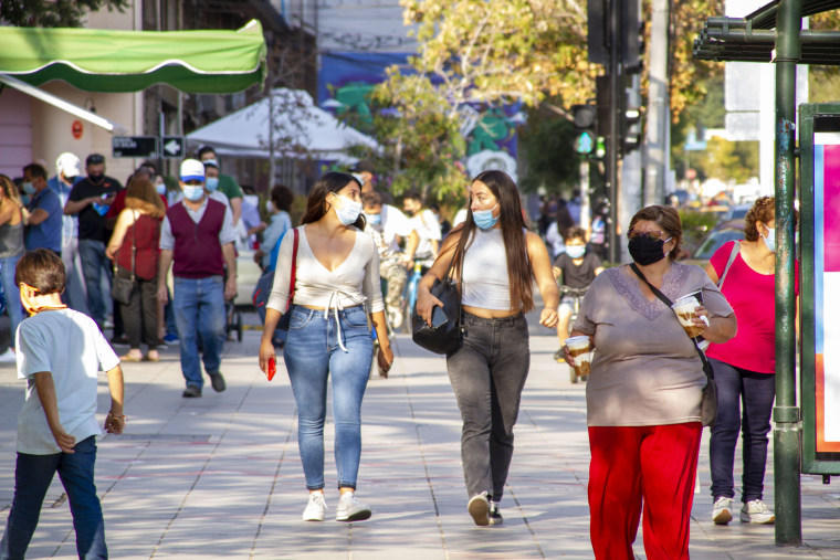 People wear masks in Santiago, Chile, on March 24, 2021.