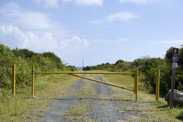 A gate stands closed near Ferro Port lighthouse at Verdiales Key point on the south coast of Vieques island, Puerto Rico on  Jan. 13, 2017.