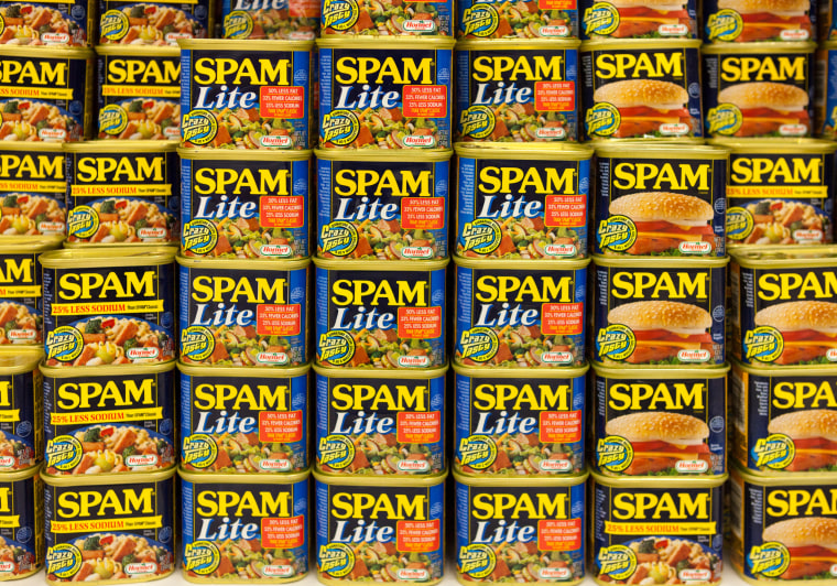 Cans of various varieties of Spam stacked for sale in a supermarket in Waimea, Big Island, Hawaii
