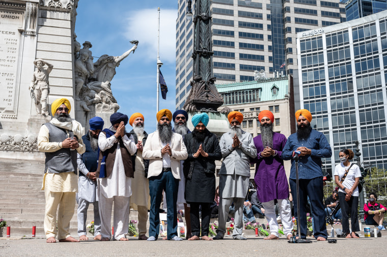 Image: Leading members of the Sikh community gather in prayer at Monument Circle on April 18, 2021 in Indianapolis during a vigil held in the wake of a mass shooting at a FedEx Ground Facility.