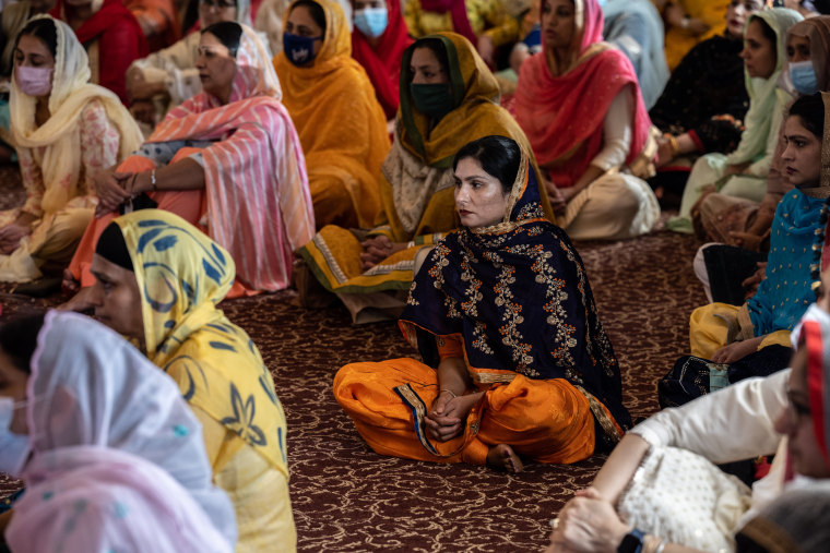 Image: Members the Sikh community in the prayer hall at the Sikh Satsang of Indianapolis on April 18, 2021.