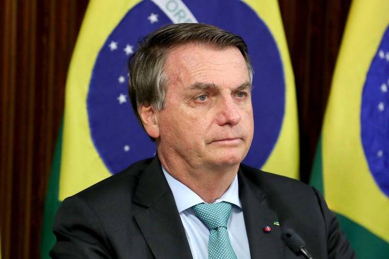 Image: Brazil's President Bolsonaro attends a virtual global climate summit via a video link in Brasilia