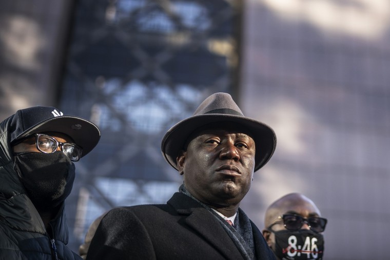 Attorney Ben Crump holds a news conference alongside George Floyd's brothers Terrence and Philonise, right, at the Hennepin County Government Center in Minneapolis on March 29, 2021.