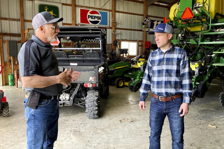 Farmer Rick Clifton, left, talks with Bryan Randall, an agronomist with Indigo Agriculture in Orient, Ohio, on April 5, 2021.