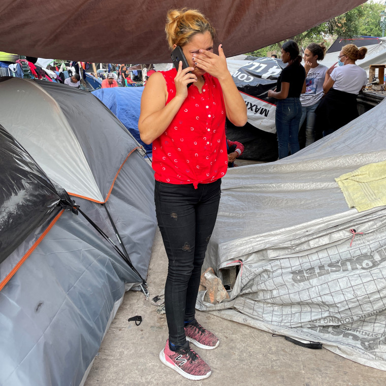 A sobbing Carolina calls her family in Honduras moments after being deported to Reynosa with her 12-year-old daughter, Genesis.

