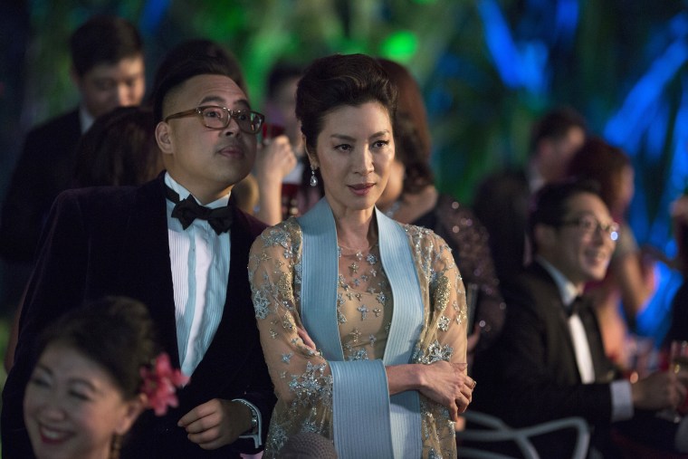 Nico Santos as Oliver and Michelle Yeoh as Eleanor in "Crazy Rich Asians."