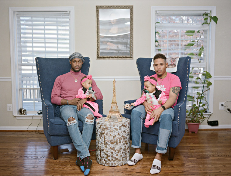 Vernon and Ricardo with their twin girls at home in Clinton, Md.