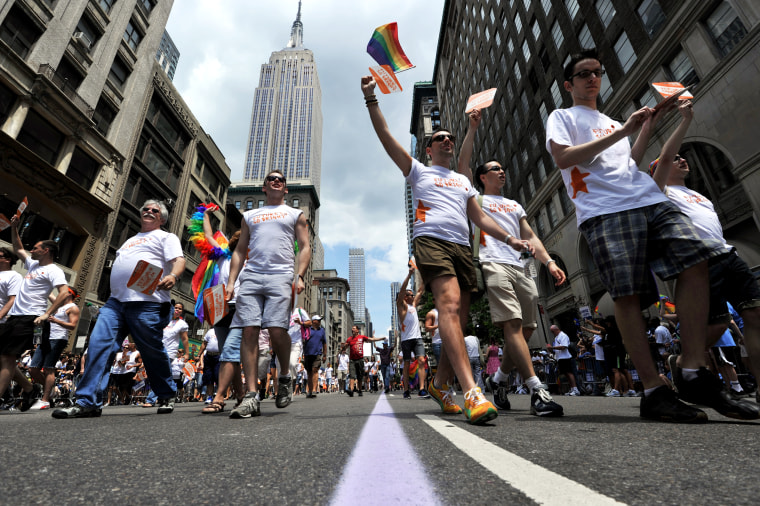 A group walks down Fifth Avenue during t