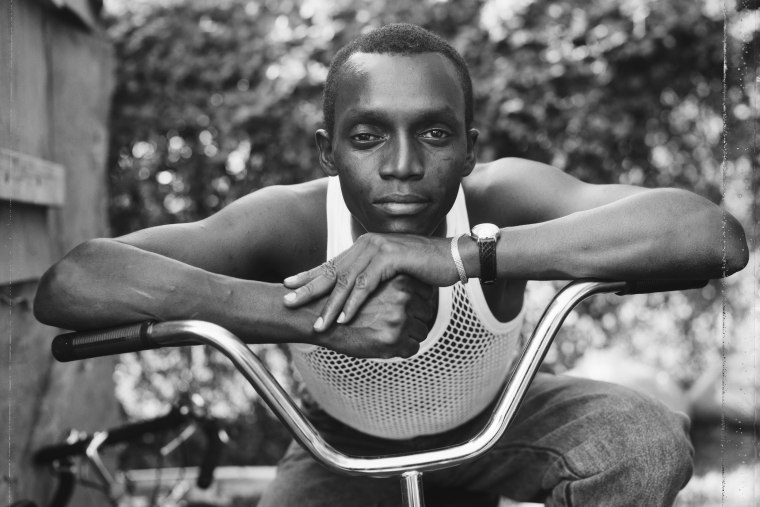 A young man resting on an exercise bike in Amityville, N.Y., in 1988.