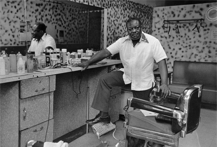 Deas McNeil, the barber, Harlem, N.Y., 1976.