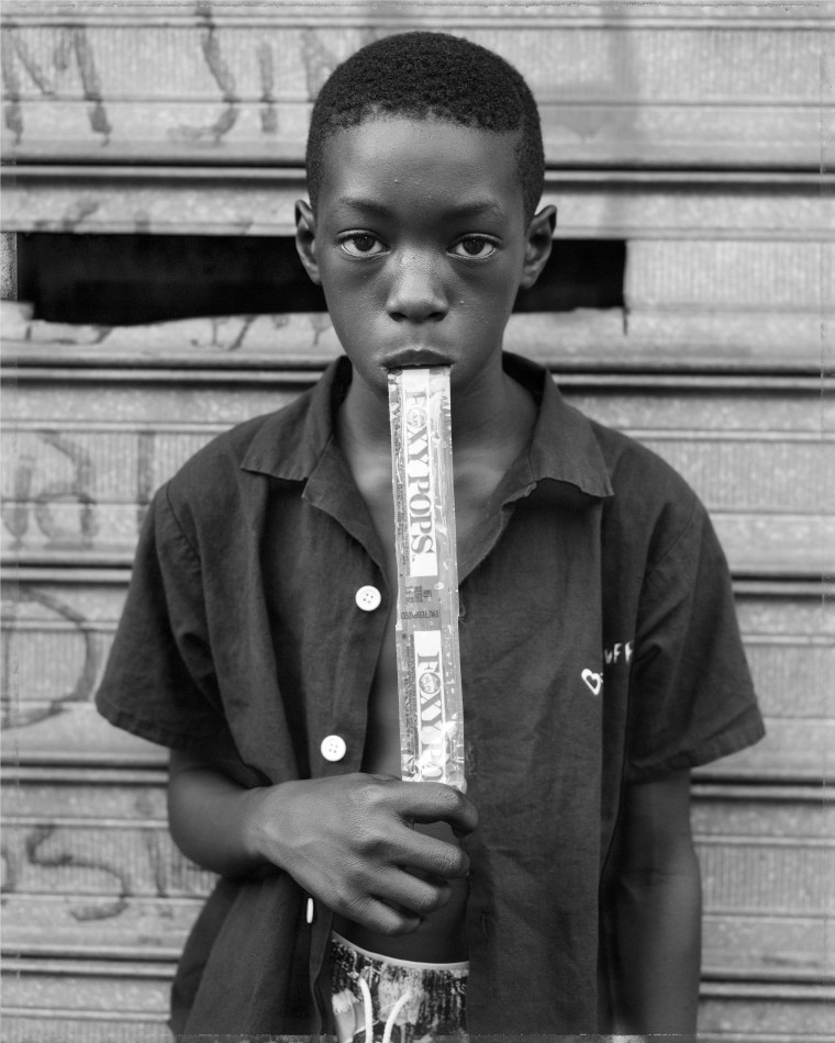 A boy eating a Foxy Pop in Brooklyn, N.Y., in 1988.