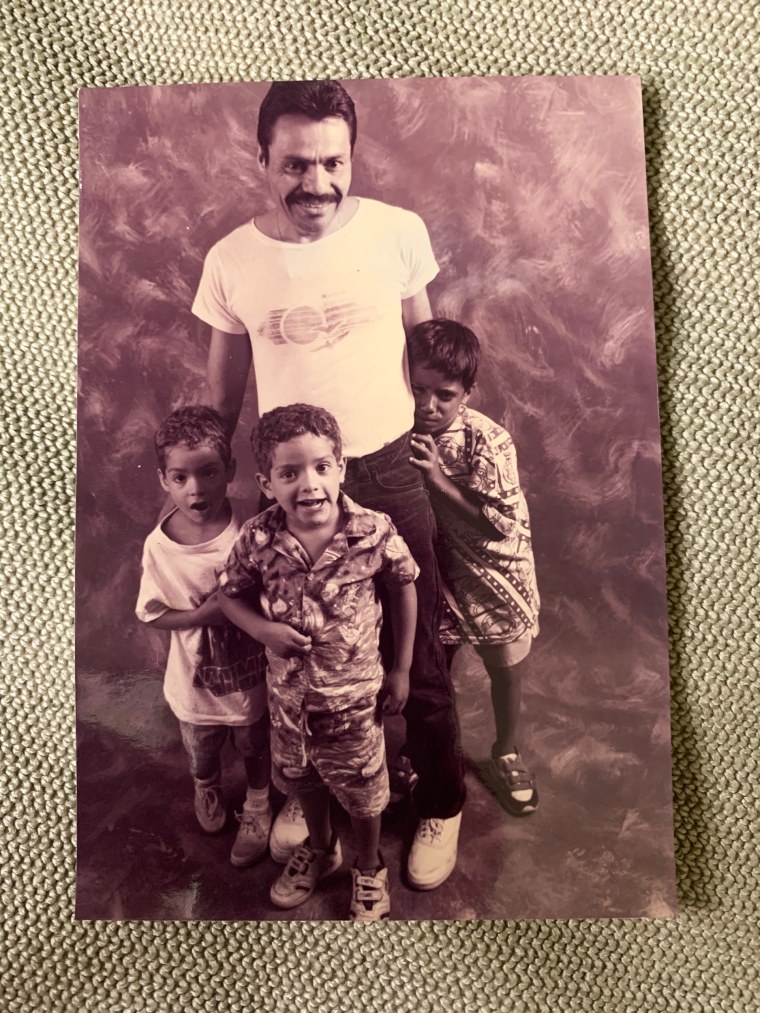 Louis Arce with his children Joey, Angel and Noel.