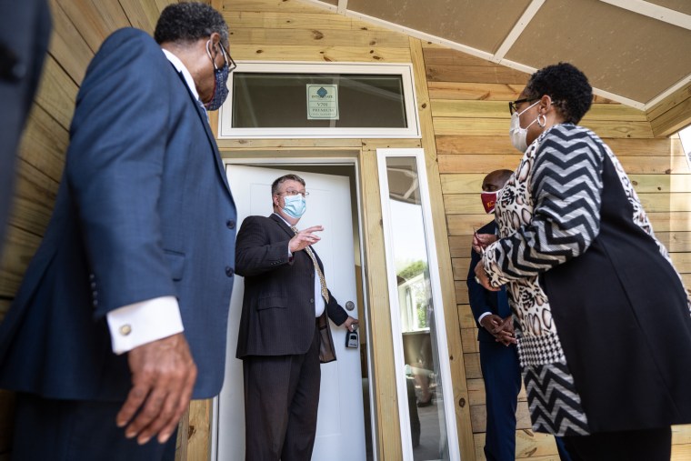 From left, Rep. Emanuel Cleaver, Kansas City Mayor Quinton Lucas and Secretary Marcia Fudge tour a sustainable home in Kansas City, Mo.