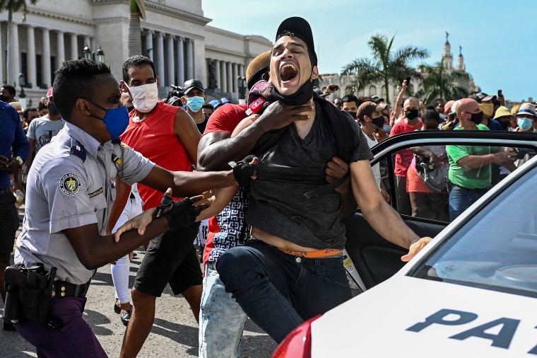 Image: A man is arrested during a demonstration against the government of Cuban President Miguel Diaz-Canel in Havana, on July 11, 2021.